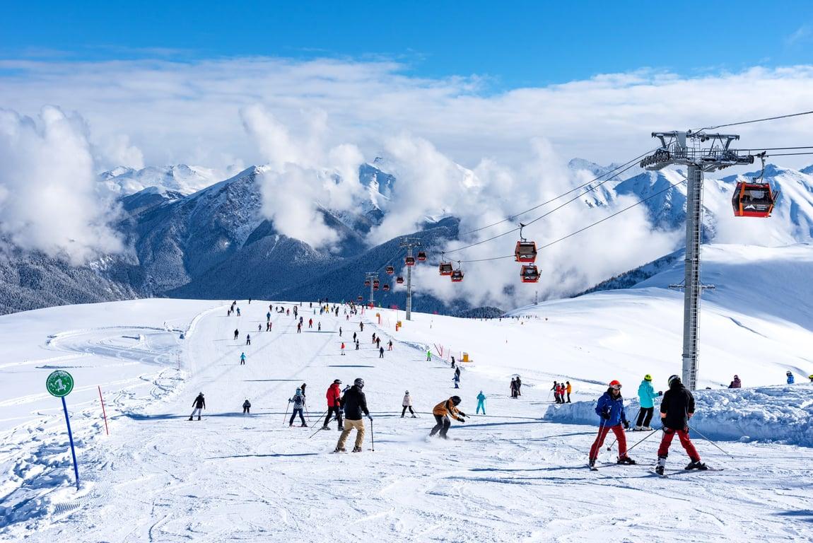 Tourists skiing at the Arkhyz Resort, Russia.